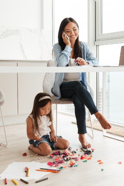 Mother And Daughter In Home Office