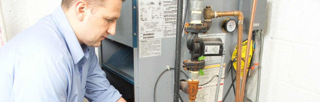 Technician Repairing Furnace